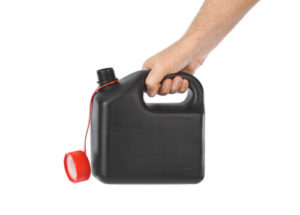 hand holding gas can