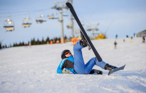 Girl falling from skiing